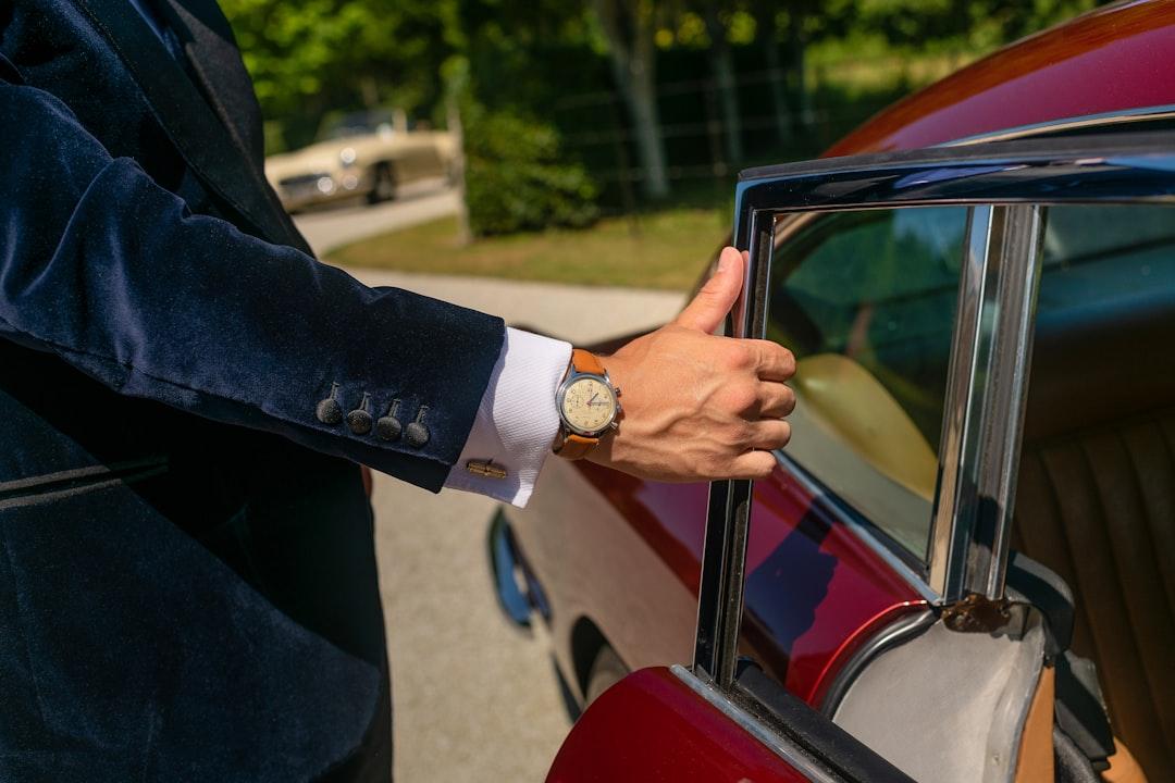 Chauffeur opening a car door for a passenger